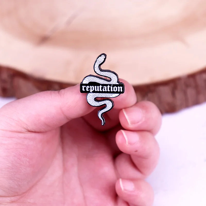 Snake Reputation Enamel brooch